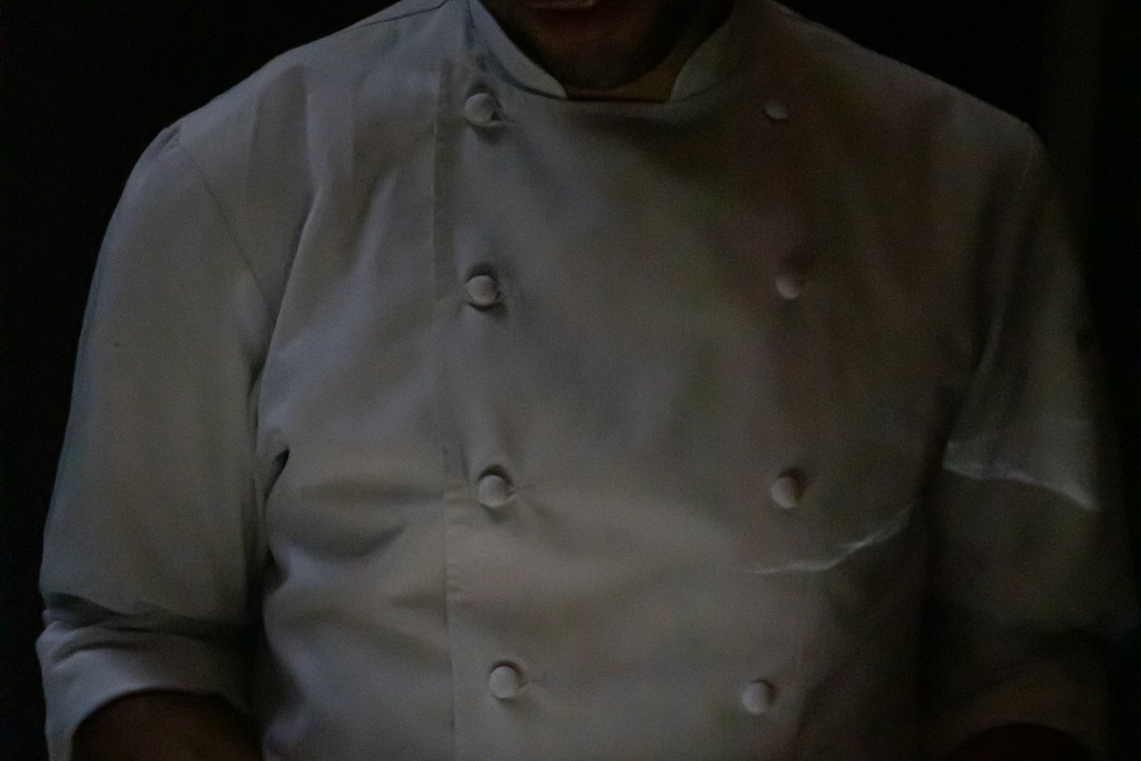 Seasonal plated dish with garnish, served on a wood table