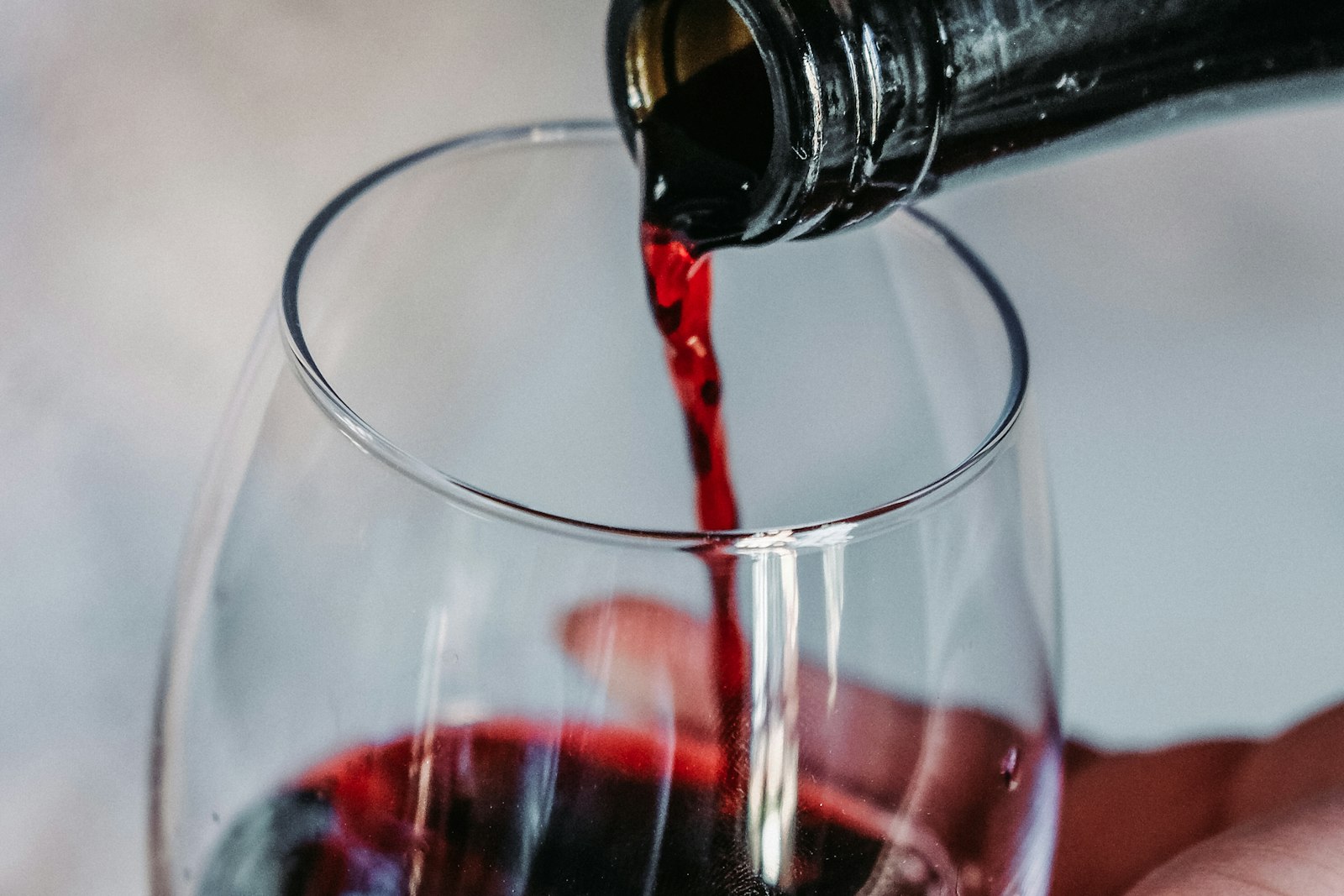 Wine being poured into a glass at the table