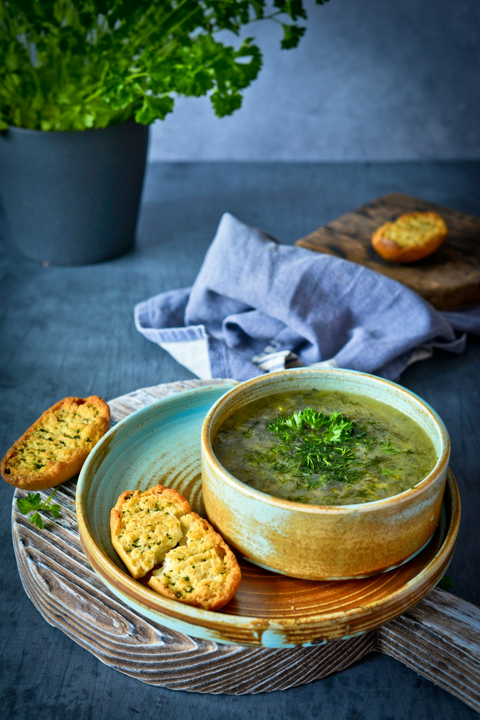 Soup served in a brown ceramic bowl
