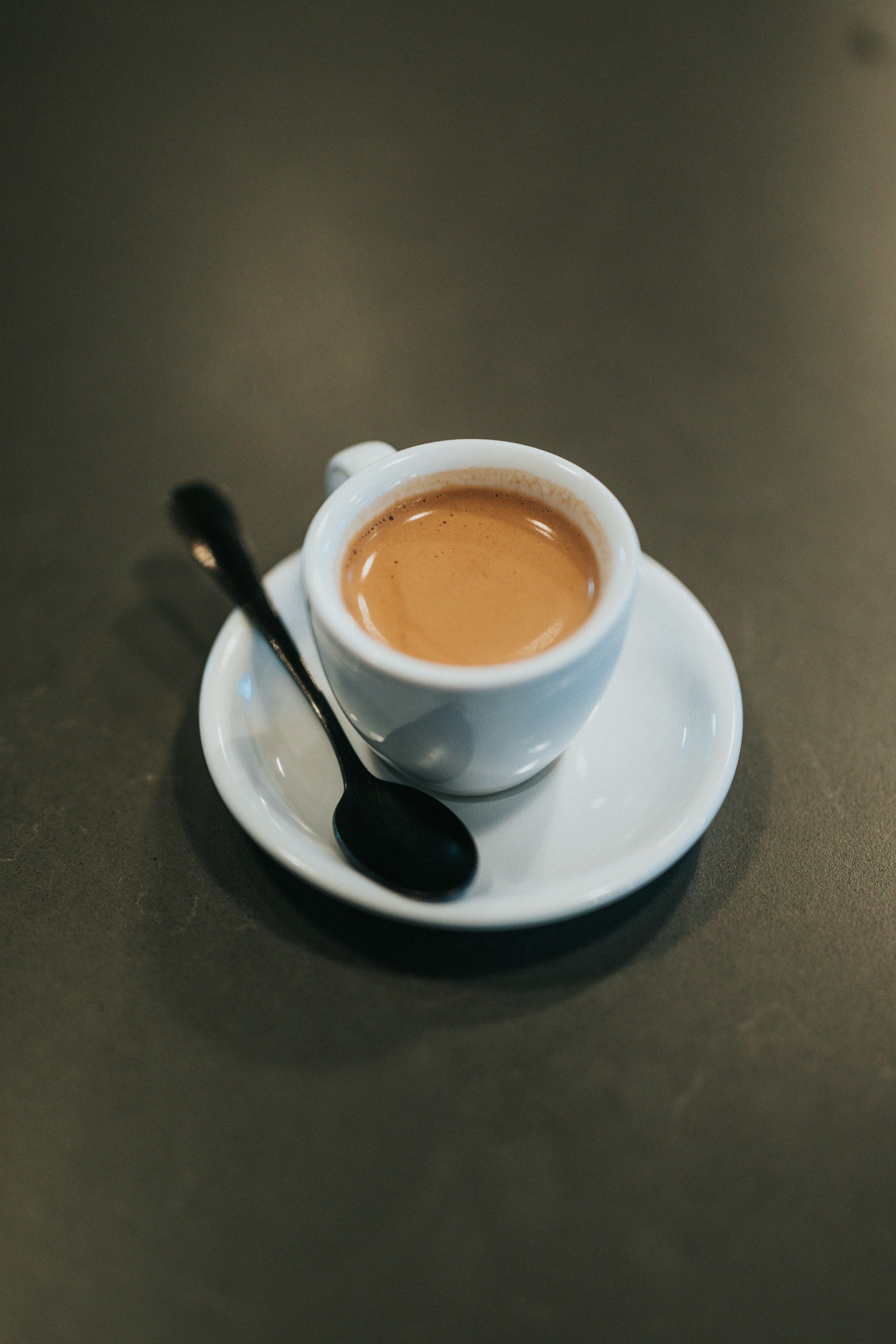A white ceramic cup of coffee