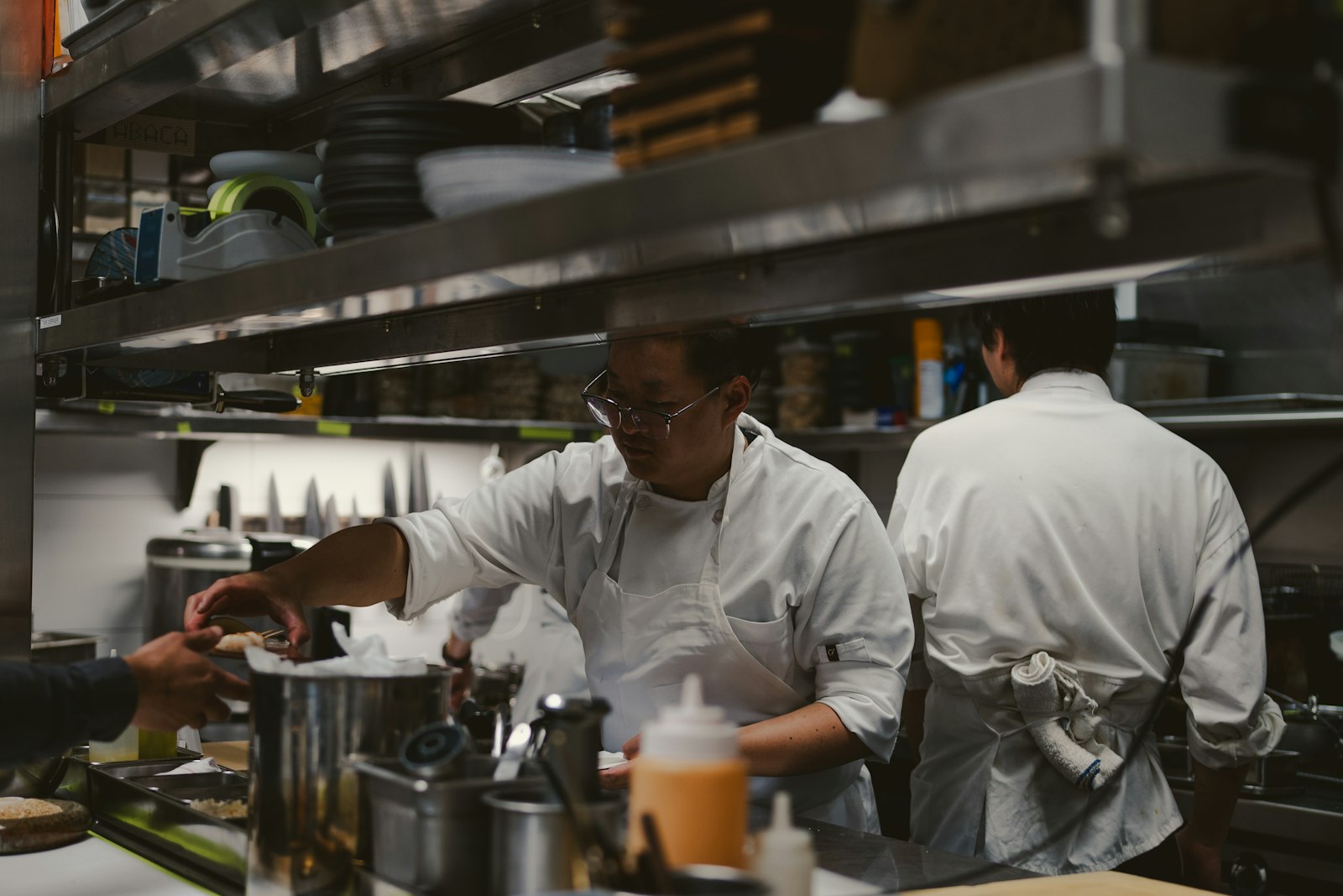 Kitchen staff working together during service