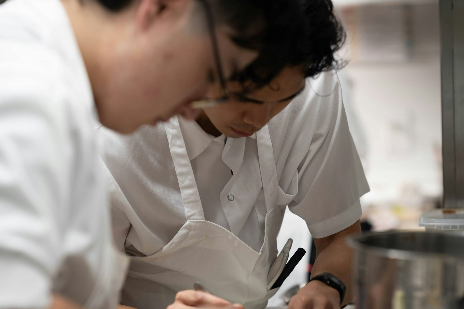 A dish being finished and plated